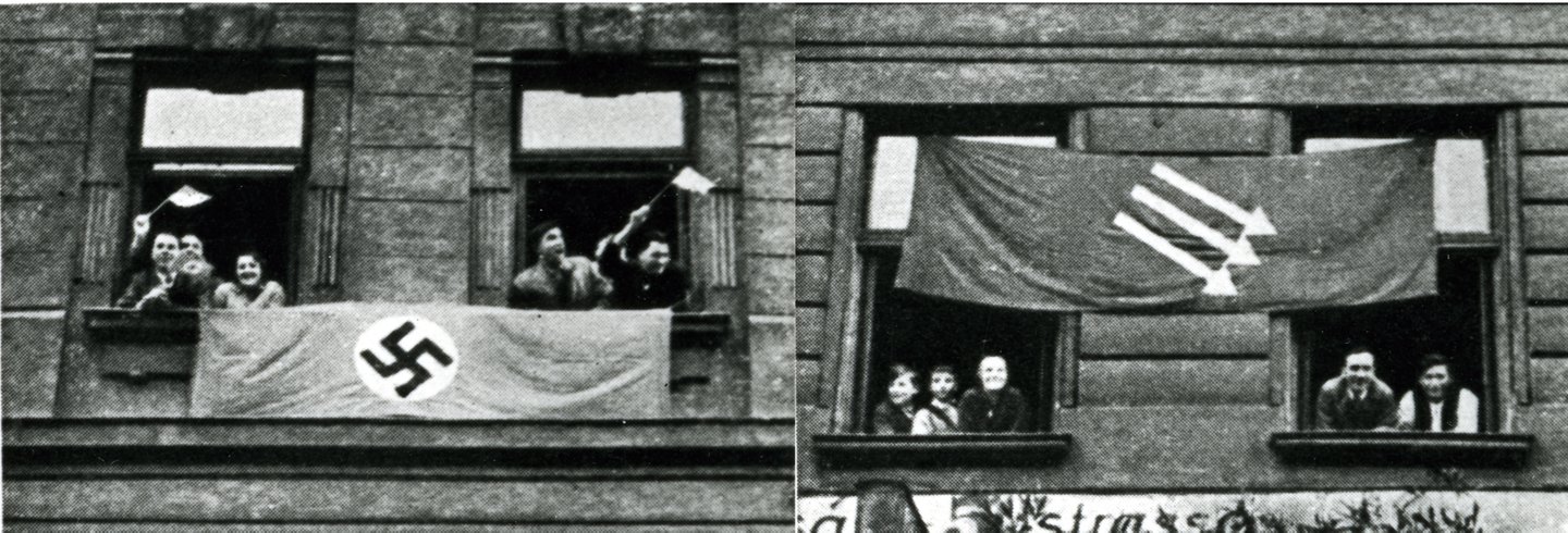 Zwei Fensterreihen im Jahr 1938, eine mit der Fahne der Nationalsozialisten und rechts mit der Flagge der Sozialdemokrat:innen