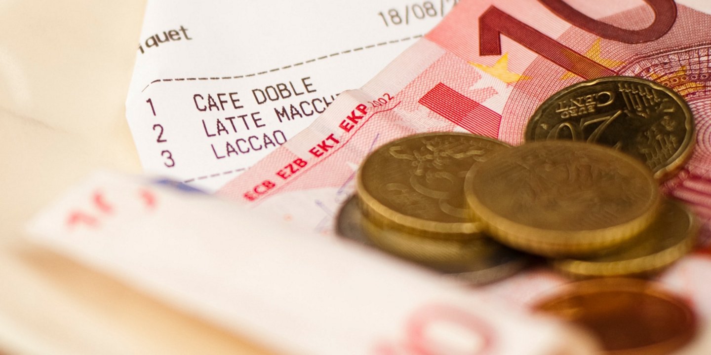 Euro notes and coins on an invoice
